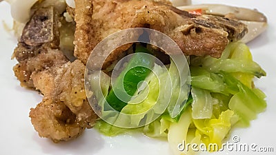 The close up of Taiwanese fried pork chop and stir fried vegetable Stock Photo