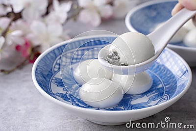 Close up of tangyuan yuanxiao in a bowl on gray table, food for Winter Solstice Stock Photo