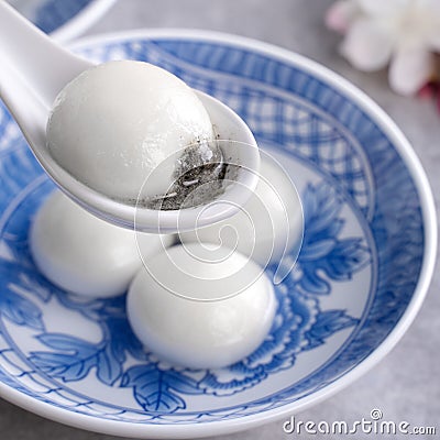 Close up of tangyuan yuanxiao in a bowl on gray table, food for Winter Solstice Stock Photo