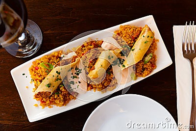 Tasty Moroccan lamb spring roll with harissa and couscous Stock Photo