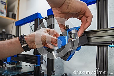 Close-up of technician doing 3D printer repair Stock Photo