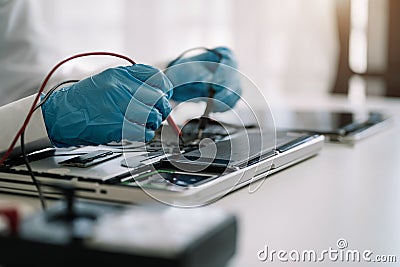 Close up of Technician measuring voltage electronic circuit board, Service after sale fix electric equipment Stock Photo