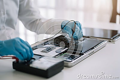 Close up of Technician measuring voltage electronic circuit board, Service after sale fix electric equipment Stock Photo