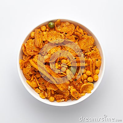 Close up of Teekha Meetha crunchy spicy Indian namkeen snacks on a ceramic white bowl. Stock Photo