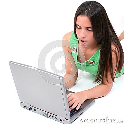 Close Up Of Teen With Funny Expression Working On Laptop Stock Photo