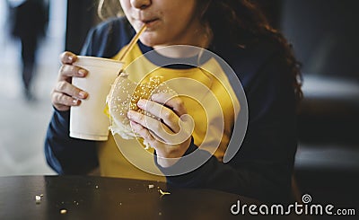 Close up of teenage girl eating hamburger obesity concept Stock Photo