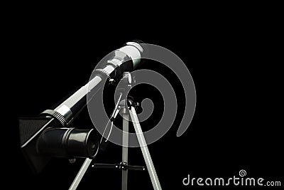 Close up of telescope eyepiece over black Stock Photo