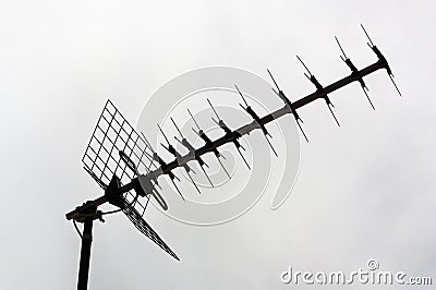 Close-up of a terrestrial digital tv antenna against the backlight of the cloudy sky Stock Photo