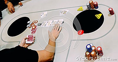 Close up of Texas Hold `em Tournament game where two players are all in AK vs QQ Editorial Stock Photo