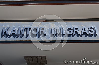 Close up of the text Kantor Imigrasi Immigration Office of Denpasar, Bali Editorial Stock Photo