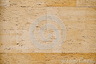 Close-up texture of beige travertine, on wall tiles. Stock Photo