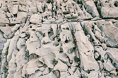 Close-up texture of gray massive stones of rock formation. Stock Photo