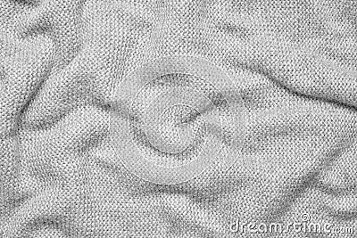 Close up texture of light gray crumpled woven fabric with a subtle pattern of evenly spaced tiny dots, providing a soft Stock Photo