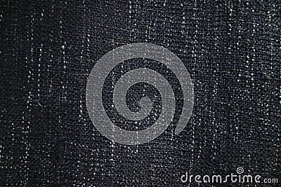 Close up texture of navy blue fabric blanket or throw. Black,grey and white vertical flecks Stock Photo