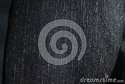 Close up texture of navy blue fabric blanket or throw. Black,grey and white vertical flecks Stock Photo