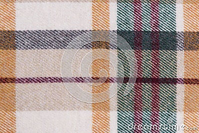 close-up texture of warm checkered tartan fabric in beige, green and red colors. Image for your design. material for making warm Stock Photo