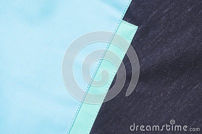 Close-up of textured fabric cloth textile background Black and blue part of jacket Stock Photo