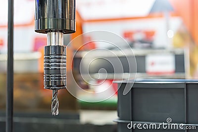 Close up threading tap tool setting on collet chuck of accuracy universal high speed electric screw drilling and tapping machine Stock Photo