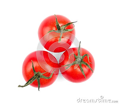 Close-up of three bright red tomatoes with leaves isolated on a white background. Juicy and fresh tomatoes. Healthy vegetables. Stock Photo