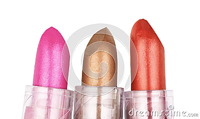 Close up of three lipsticks in different colors isolated on whit Stock Photo