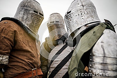 Three medieval knights in armor. Stock Photo