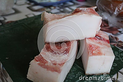 Close-up of three pieces of lard on the kitchen table Stock Photo