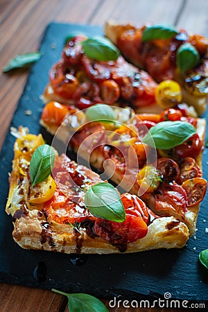 Close-up of tomato puff pastry tart Stock Photo