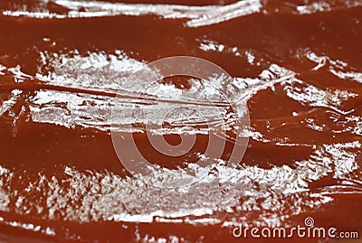 Close up of tomato sauce or ketchup spreading on plate Stock Photo