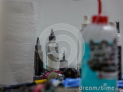 Close-up of tools and jars used to make a tattoo Stock Photo