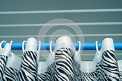 Close up top of shower curtain with zebra pattern Stock Photo