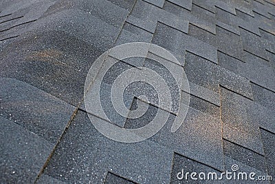 Close up top view on corner roof made is asphalt roofing shingles. Stock Photo