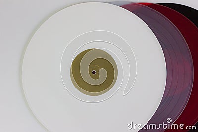 Close up, top view of four vinyls, black, red, blue and white, on white background Stock Photo
