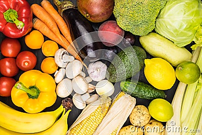 Close-up top view image of fresh organic vegetables and fruit. L Stock Photo