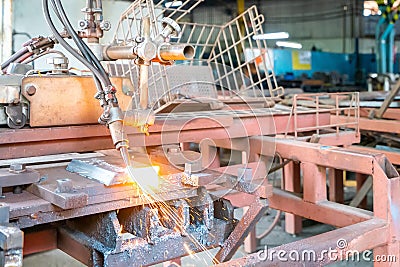 Close up torch or tip and flame with sparkle form oxygen and acetylene of gas cutting machine for industrial at factory Stock Photo