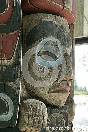 Close up of a face on a totem pole in Vancouver, Canada Stock Photo