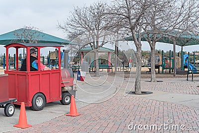 Kid trackless train ride in public winter event in Irving, Texas Editorial Stock Photo