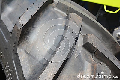 Close up on tractor wheel new tire protector Stock Photo