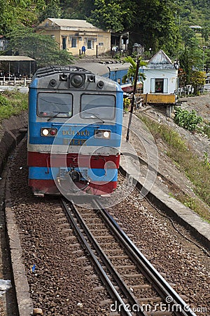 Close up of a train running on the railway over Hai Van mountain pass in the central Vietnam Editorial Stock Photo