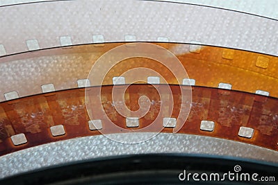 Clear acetate ribbon of 8 millimeter film against white background Stock Photo