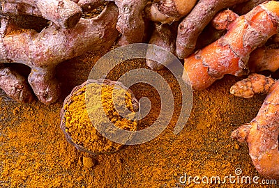 Close up turmeric powder on grunge wooden background. Stock Photo