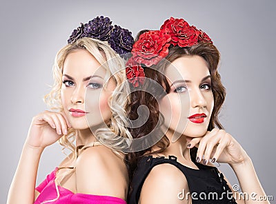 Close-up of two beautiful ladies wearing flower headbands Stock Photo