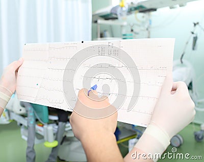 Close-up of two doctors interpretive cardiogram of patient Stock Photo