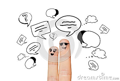 Close up of two fingers with communication clouds Stock Photo