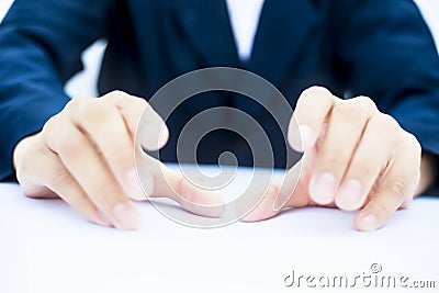 Close up of two hands of a business man wearing blue suit on white trying to save something imagery. Stock Photo