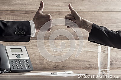 Close up of two hands with thumbs up Stock Photo