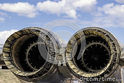 Close up of two jet engines under cloudy skies Stock Photo