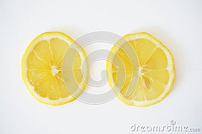 Close-up of two lemons slices in the white background Stock Photo