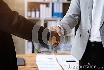 Close up two men shake hands at business meeting, office negotiations. Making deal sign, conclude contract Stock Photo