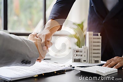 Close up two men shake hands at business meeting, office negotiations. Making deal sign, conclude contract, reach agreement, Stock Photo