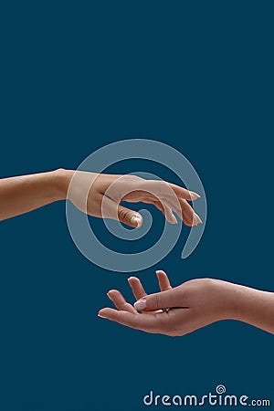 Close up of two open cupped female hands with empty space between them isolated over blue background Stock Photo